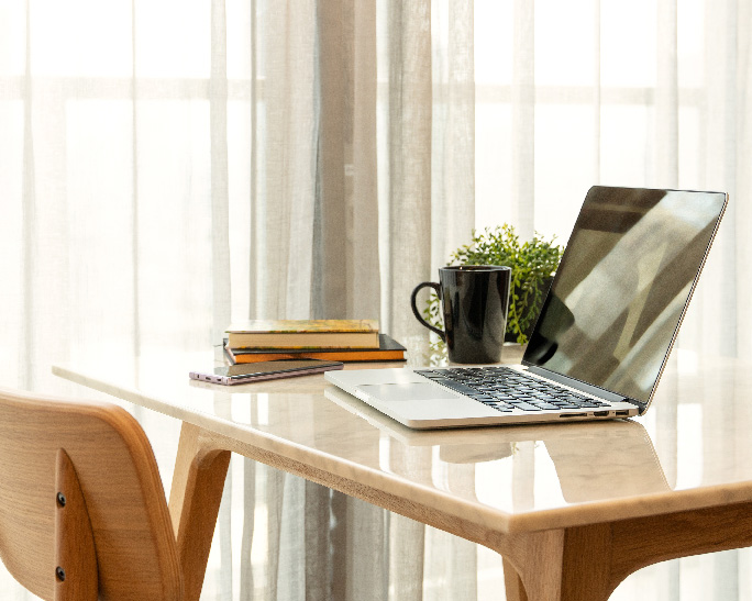 Laptop on a desk with chair; Contact Multimental Therapy in NJ